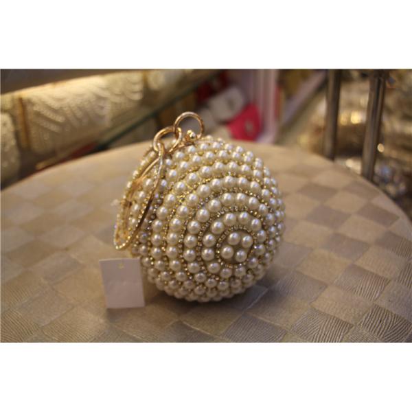 Round high-grade pearls evening bags woman holding a high-end fashion evening bag bride