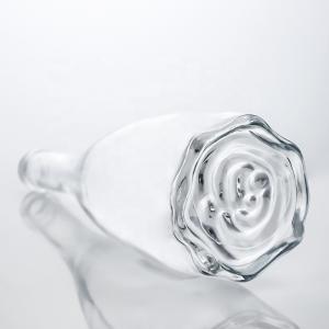China Custom Logo Unique Floral Bottom Super Flint Long Neck 750ml Glass Bottle for Gin Cork wholesale