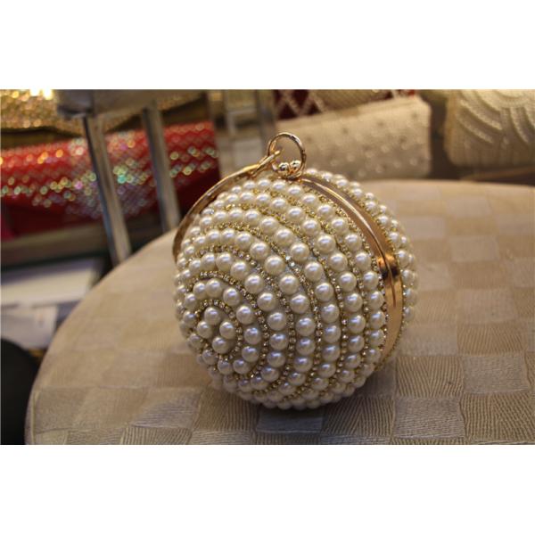 Round high-grade pearls evening bags woman holding a high-end fashion evening bag bride