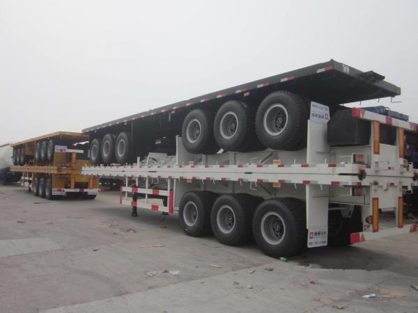Quality tri-axle container semi-trailer lowest price 40ft flat bed trailer with container locks for sale